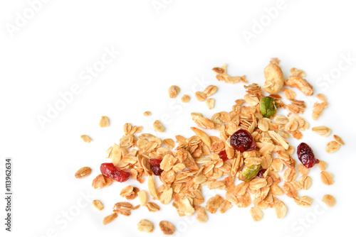 Homemade granola with honey, oatmeal, nuts raisin and cranberry on white background