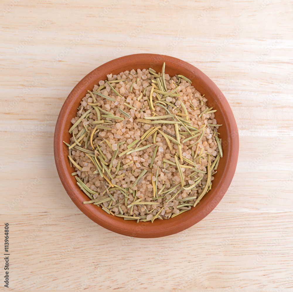 Simple blend of Tuscan seasoning in a small bowl atop a wood table. Simple blend of Tuscan seasoning in a small bowl atop a wood table.