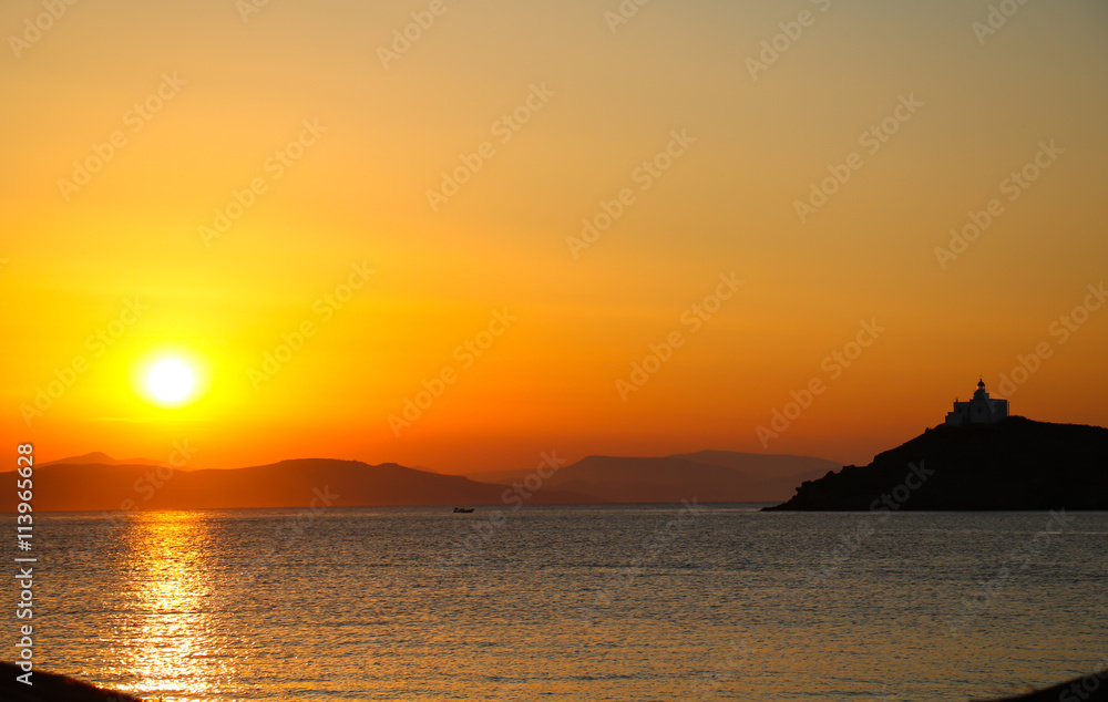 Greece - Yellow sunset over mountains at sea