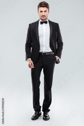 Obraz na plátně Confident attractive young man in tuxedo