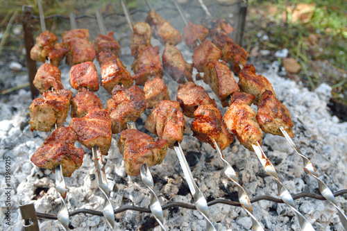 delicious grilled meat on fire