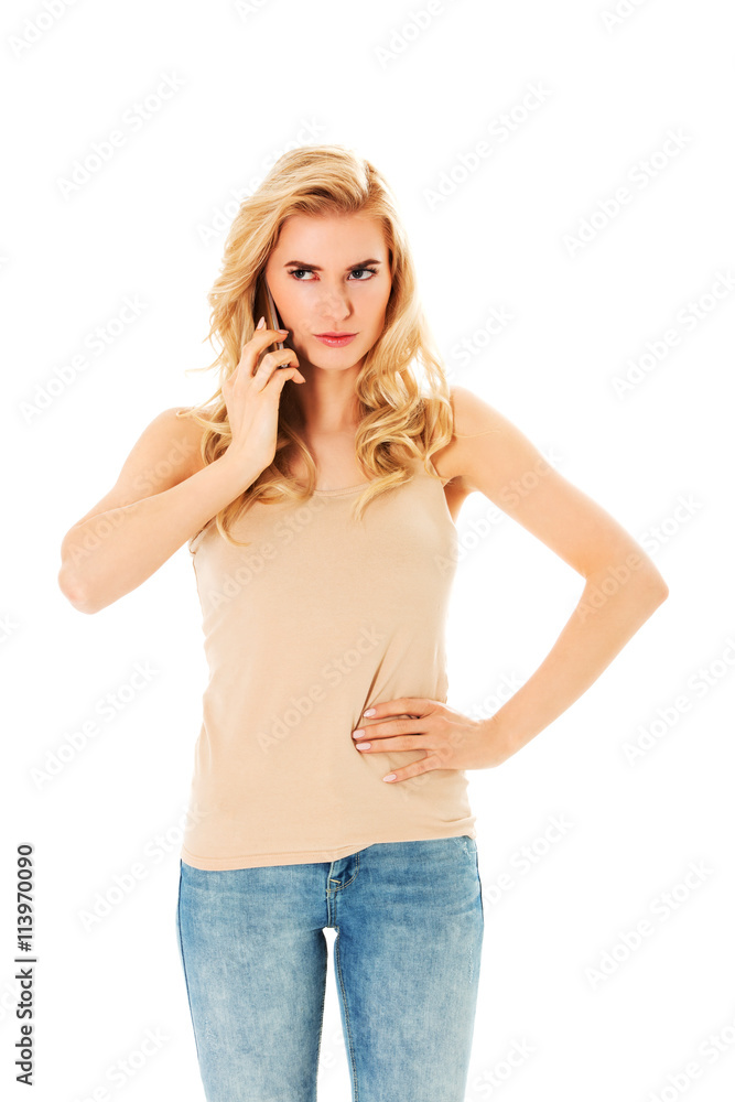 Young angry woman talking through a smartphone Young angry woman talking through a smartphone