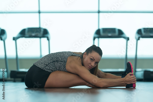 Athletic Woman Stretches