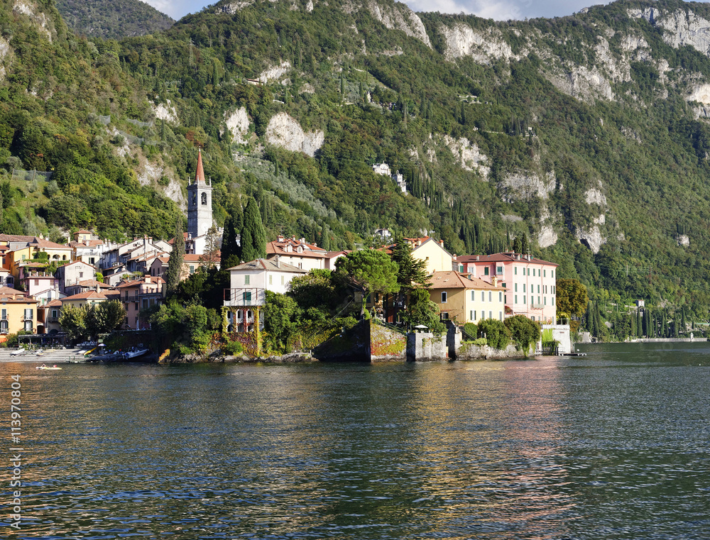 Beautiful landscape with Varenna town and San Giorgio Church seen from the ferry. Italy, september 2015