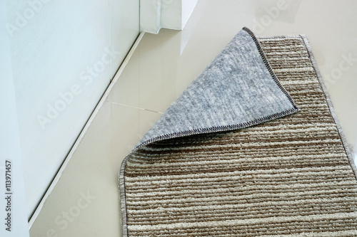 doormat in front of toilet