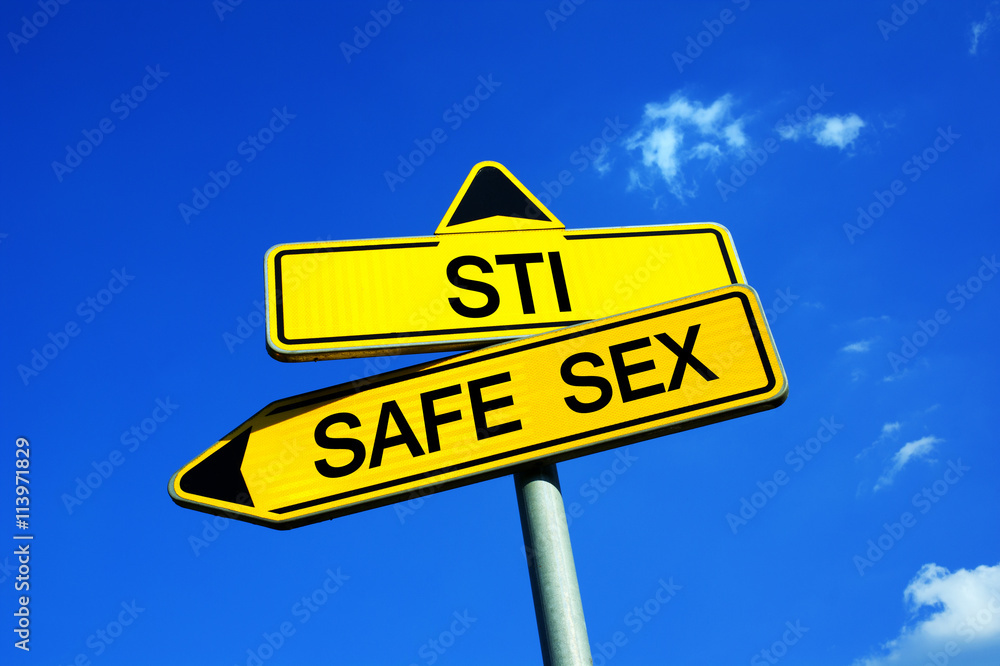 STI / STD or Safe Sex - Traffic sign with two options - Appeal to use condom as protection to not be infected by AIDS, chlamydia or syphilis during dangerous sexual intercourse STI / STD or Safe Sex - Traffic sign with two options - Appeal to use condom as protection to not be infected by AIDS, chlamydia or syphilis during dangerous sexual intercourse