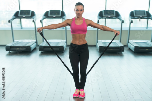 Healthy Woman Working Out With Elastic Rubber