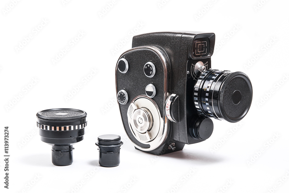 Naklejka premium Vintage movie camera and two additional lens isolated on white