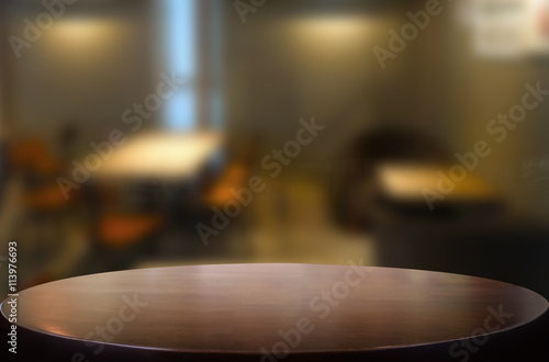 Selected focus empty brown wooden table and space of Coffee shop