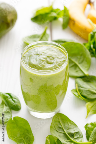 Absolutely Amazing Tasty Green Avocado Shake, Made with Fresh Avocados, Banana, Lemon Juice and Non Dairy Milk (Almond, Coconut) on Light White Wooden Background, Raw, Vegan Drink Conception, Close-up