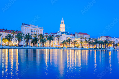 Split city waterfront blue hour. / Waterfront view at coastline panorama of town of Split in blue hour, Croatia.