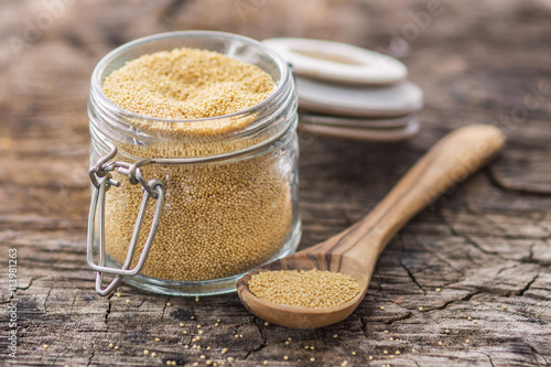 Photos Raw Organic Amaranth Grain on wooden background