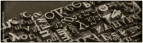 Metal Letterpress Types.  A background from many historic typographical letters in black and white with white background. © spr
