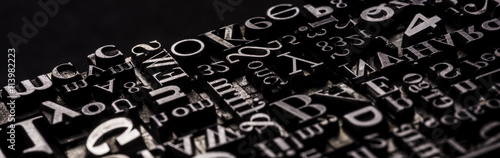Metal Letterpress Types.
A background from many historic typographical letters in black and white with white background.