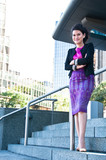 Asian business woman with Thai silk purple dress