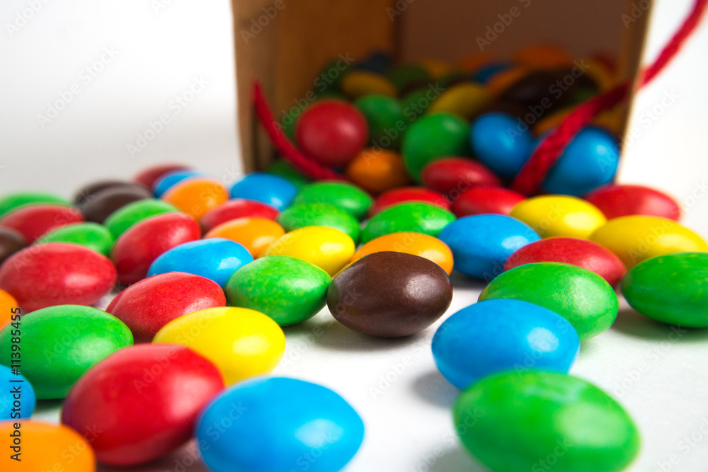 A paper bag with colorful candies A paper bag with colorful candies