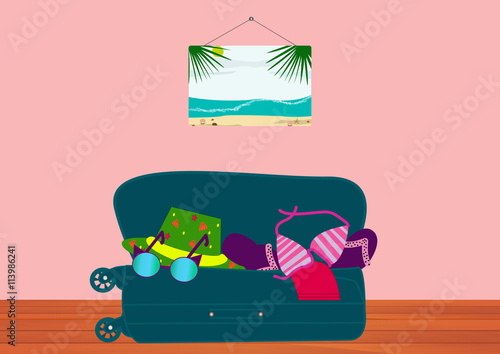 Suitcase with things for the sea lying on the wooden floor in the room. Collect suitcase in road travel.