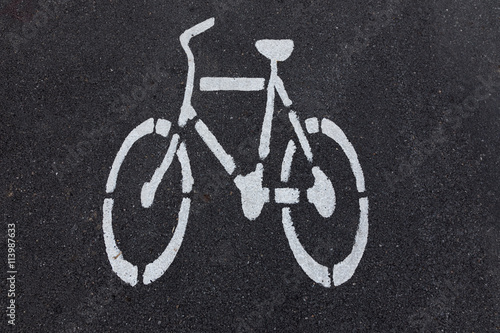 bicycle sign on asphalt bike lane