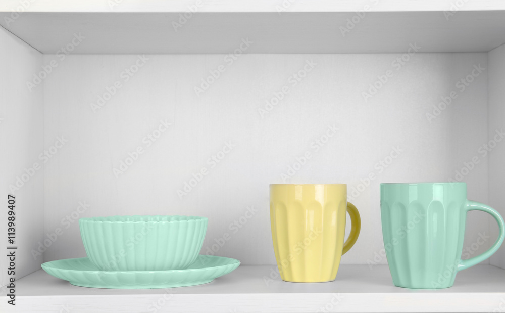 Dishes in cupboard in the kitchen Dishes in cupboard in the kitchen