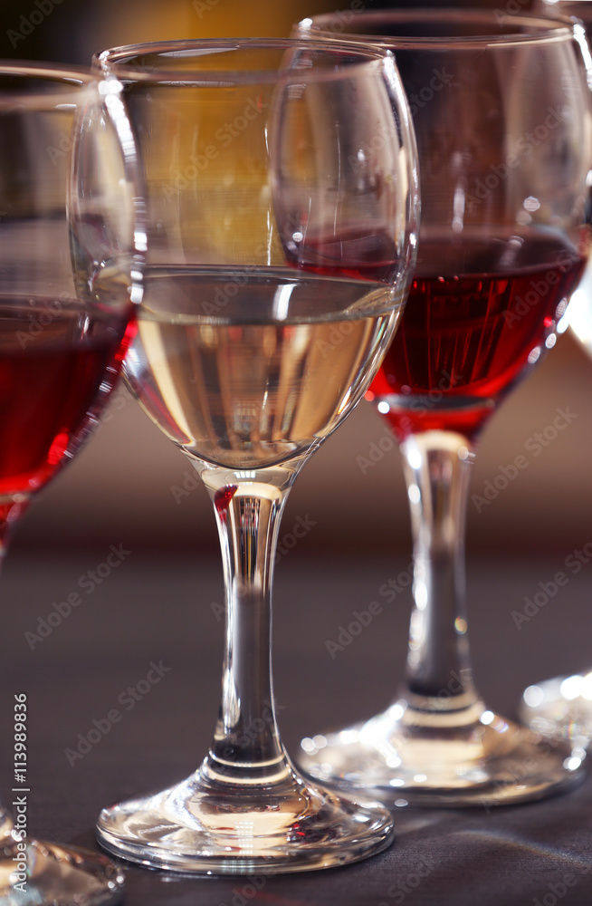 Glasses of red and white wine closeup