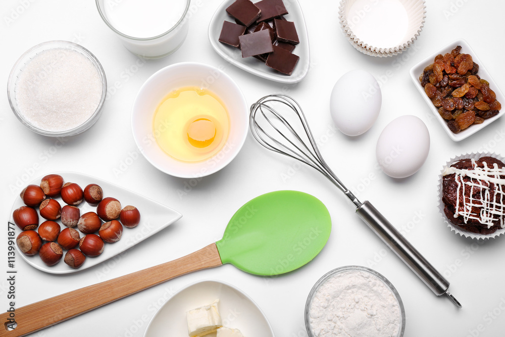 Cake ingredients on white table. Flat lay Cake ingredients on white table. Flat lay