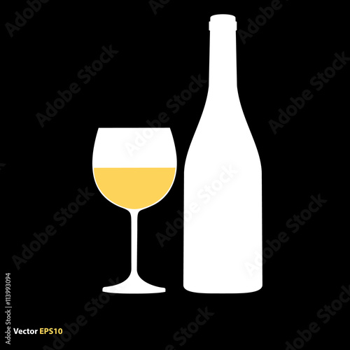 Glass and bottle of white chardonnay wine