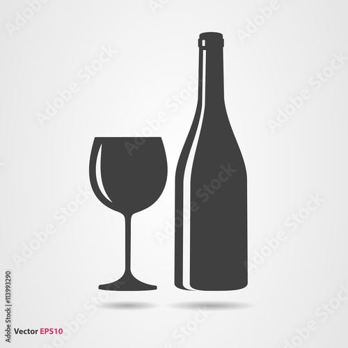 Glass and bottle of white chardonnay wine