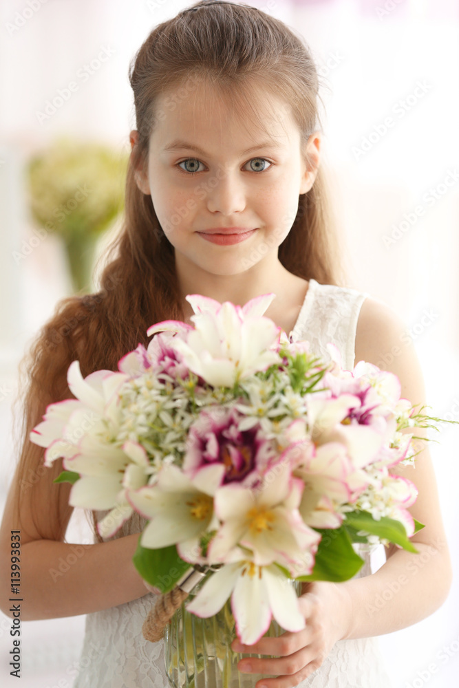 Beautiful small girl with fresh spring bouquet Beautiful small girl with fresh spring bouquet