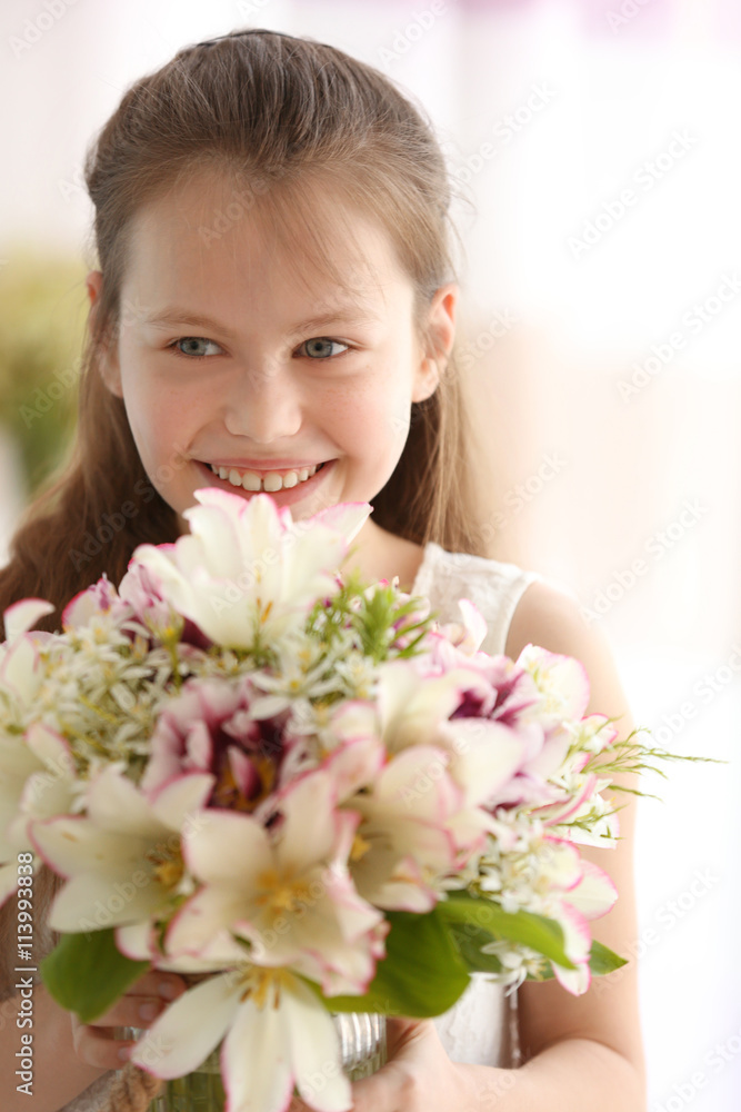 Beautiful small girl with fresh spring bouquet Beautiful small girl with fresh spring bouquet