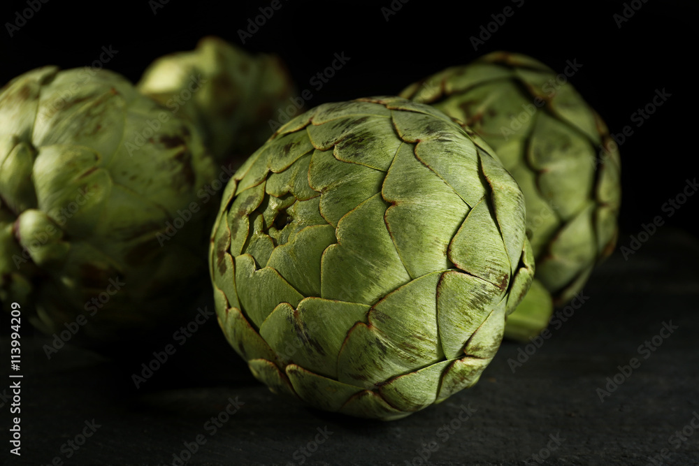 Fototapeta premium Artichokes on wooden table