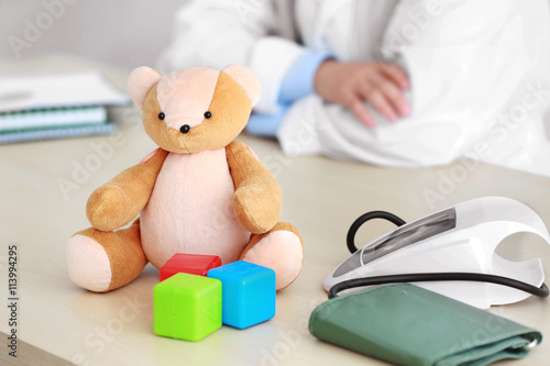 Teddy bear and doctor on ba...