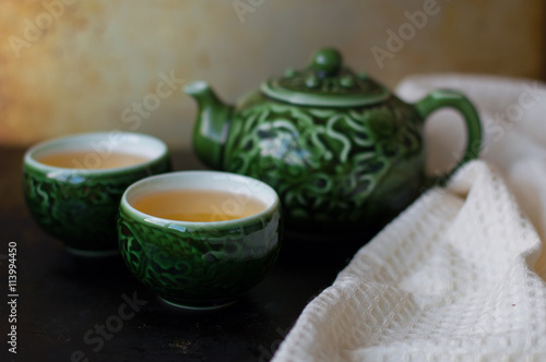Chinese tea set for traditional tea ceremony, two small cups, teakettle and white towel
