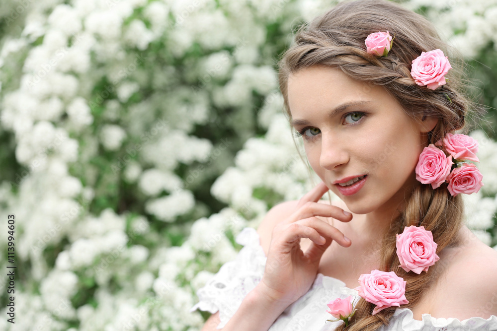 Naklejka premium Young beautiful bride in the garden