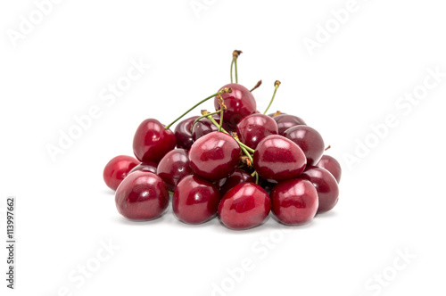 Heap of cherries on white