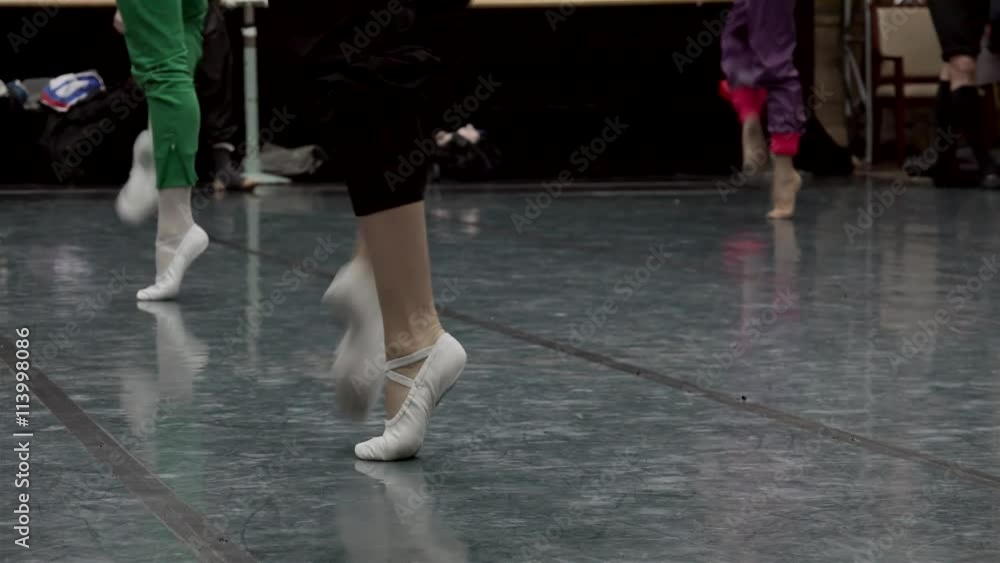 Feet of classical ballet dancers in the workout. Feet of classical ballet dancers in the workout.