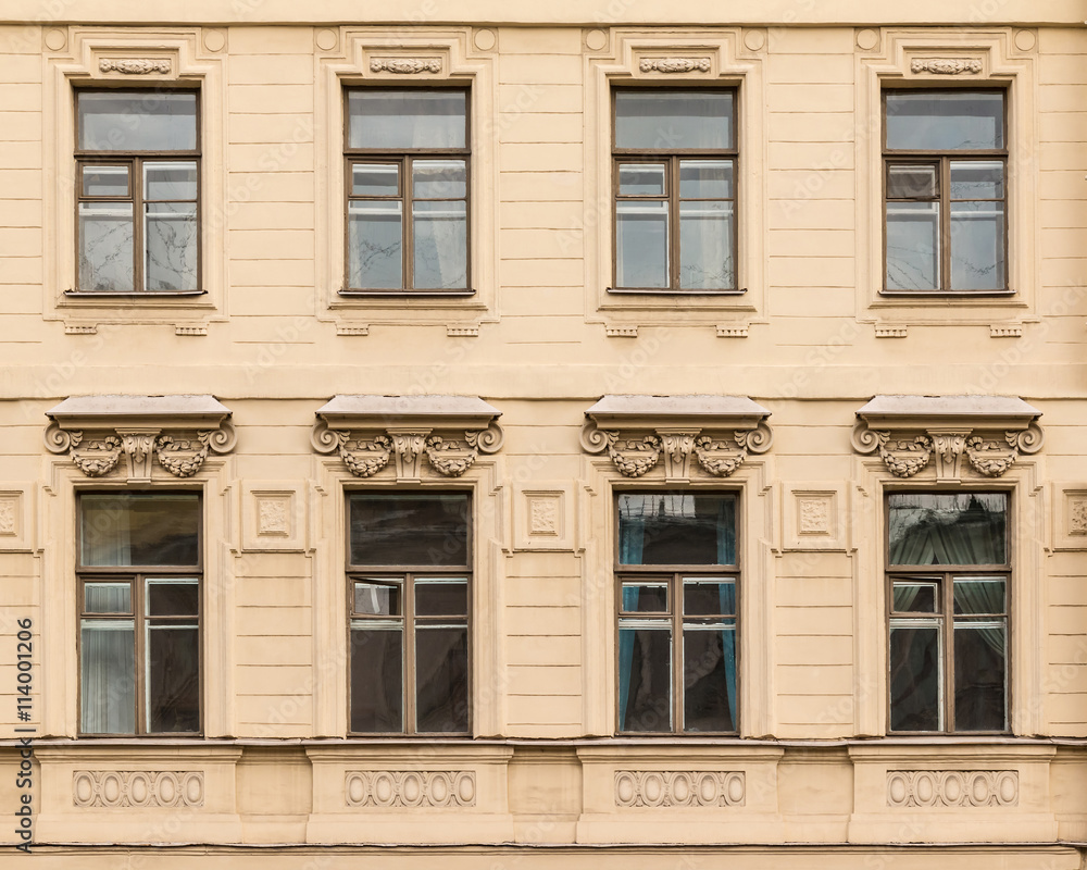 Several windows in a row on facade of the Saint-Petersburg University of Economics front view, St. Petersburg, Russia