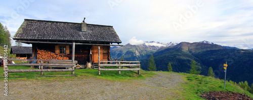 view on a hunting lodge in the austrian alps