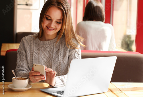 Young woman sitting in cafe