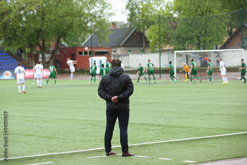 Footbal coach watching the match