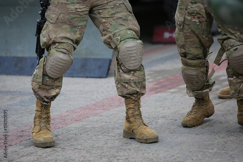 Legs of soldiers in camouflage