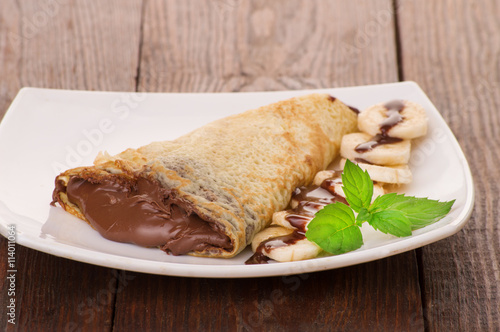 Crepes with chocolate cream and banana