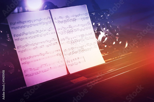 Musical notes on black pian...
