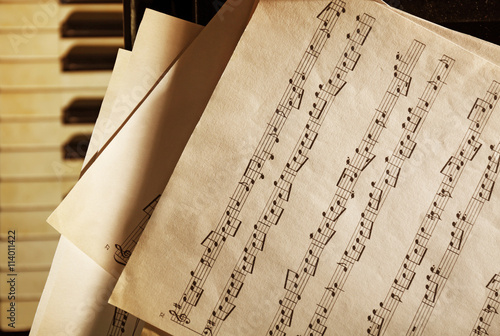Musical notes on piano keyb...