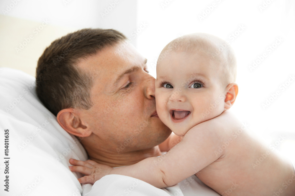 Father kissing adorable baby Father kissing adorable baby