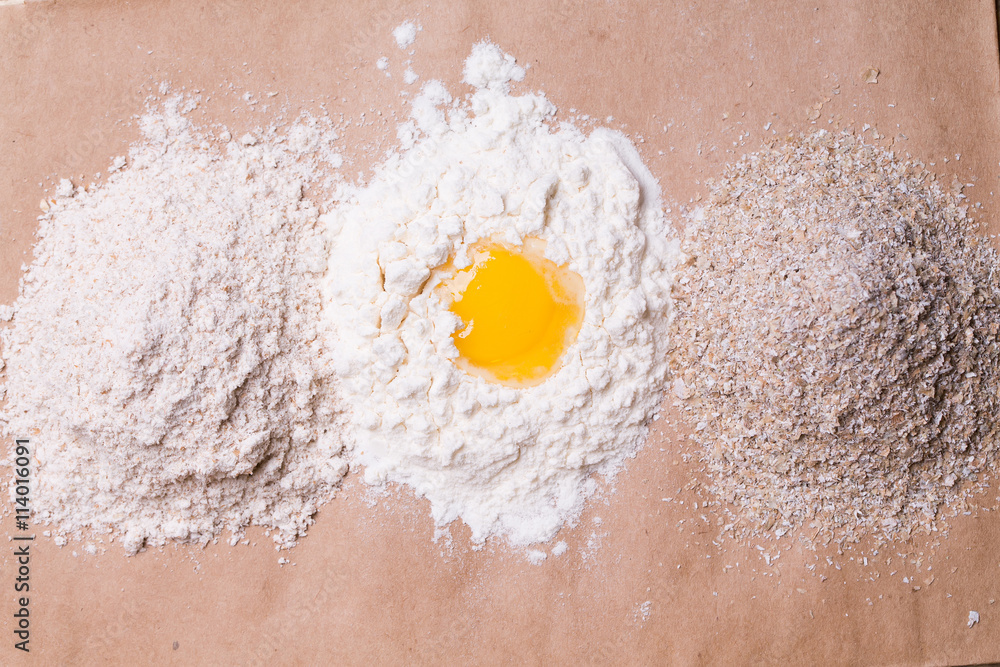 Broken egg on flour Broken egg on flour