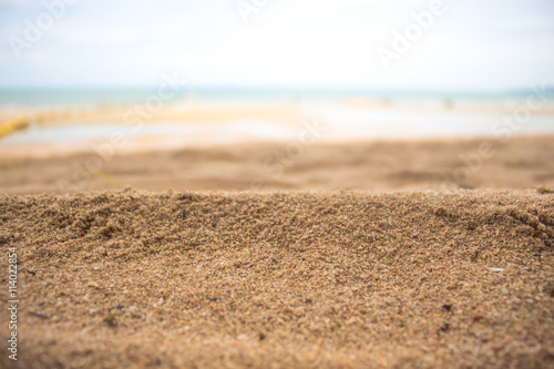 Sand and sea with sky.