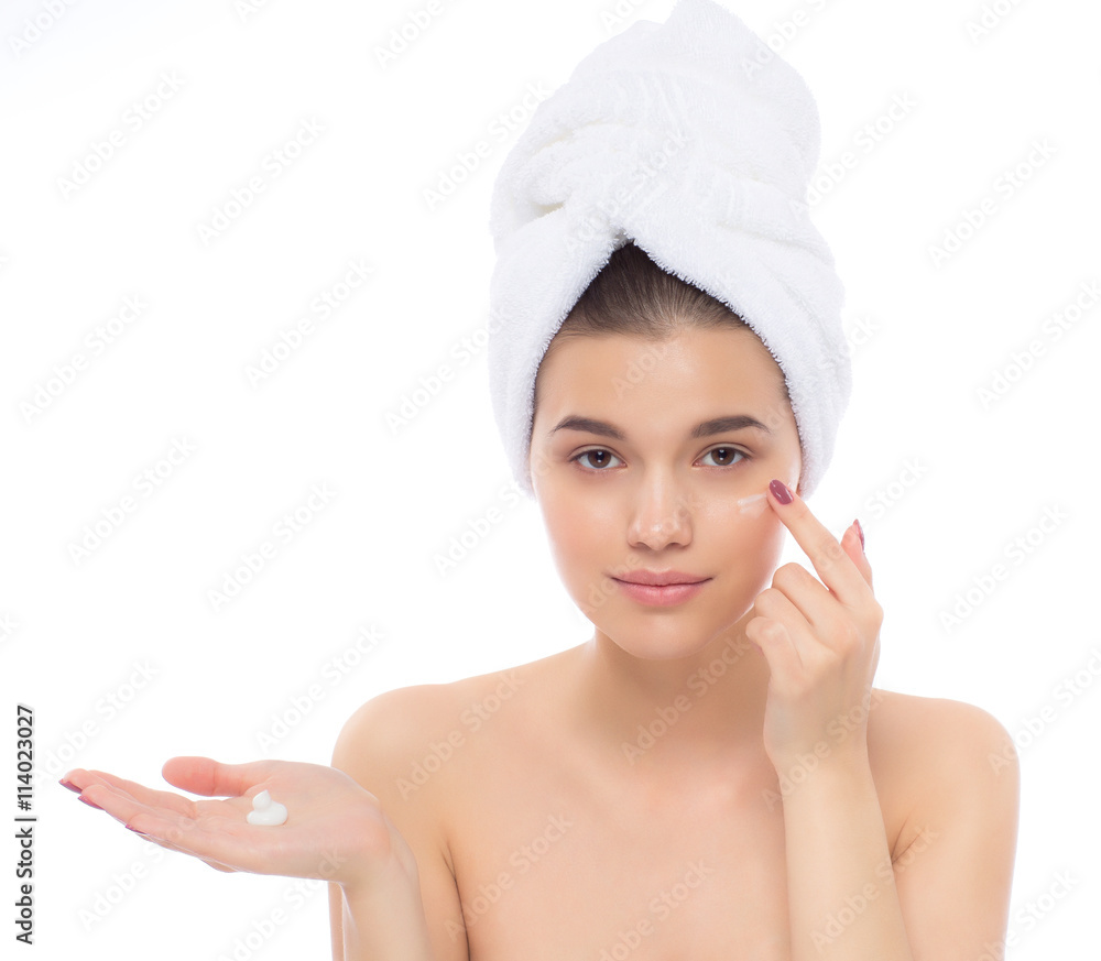 Beautiful woman with towel on head. The face cream. Beautiful woman with towel on head. The face cream.