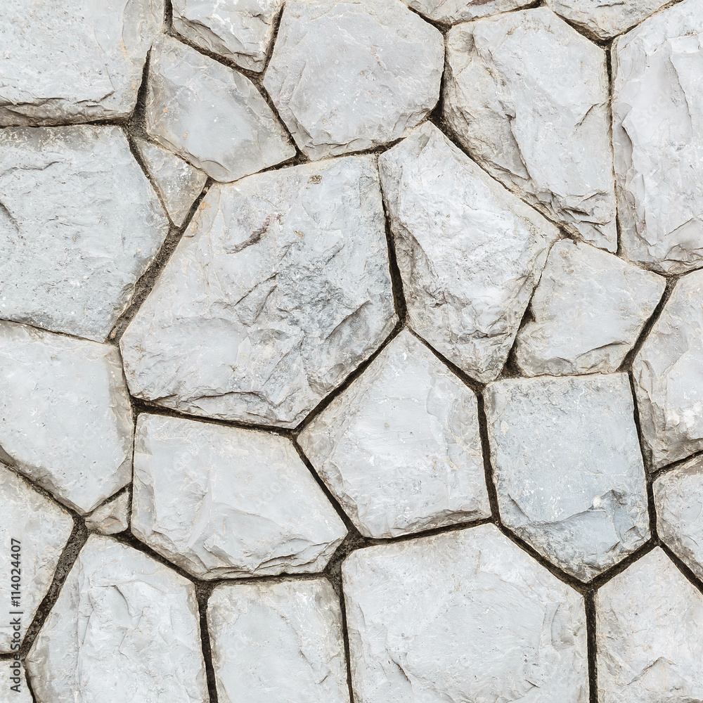 Closeup surface stone pattern at old stone wall in the garden texture background Closeup surface stone pattern at old stone wall in the garden texture background