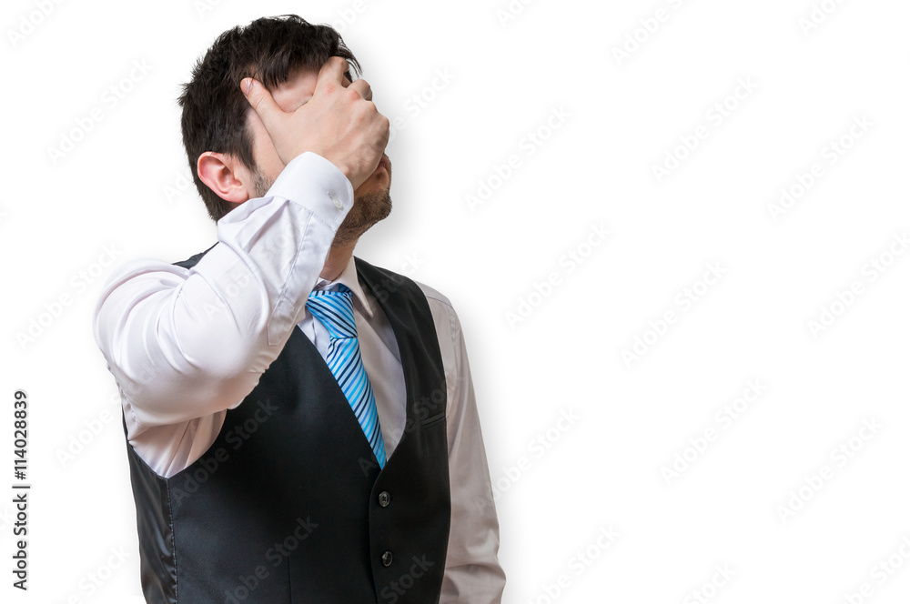 Displeased and disappointed businessman is covering his face. Isolated on white background. Displeased and disappointed businessman is covering his face. Isolated on white background.