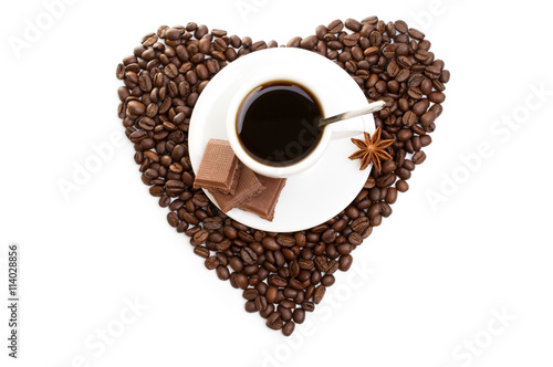 white cup of coffee on beans as a heart